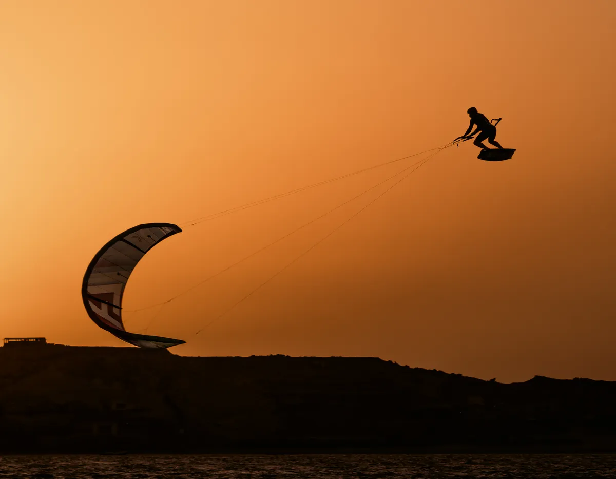Kitesurfing at sunset